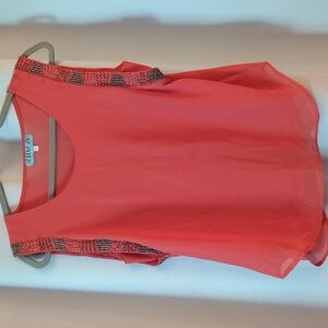 Coral shirt with gold bead design on sleeves